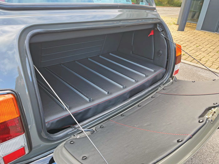 Interior view of the boot featuring a custom liner with stainless steel runners and a fitted boot light.