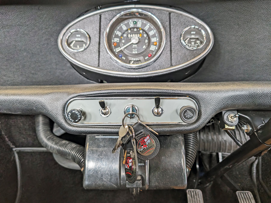 Leather dashbaord and fitted with a classic 3 gauge clock. 