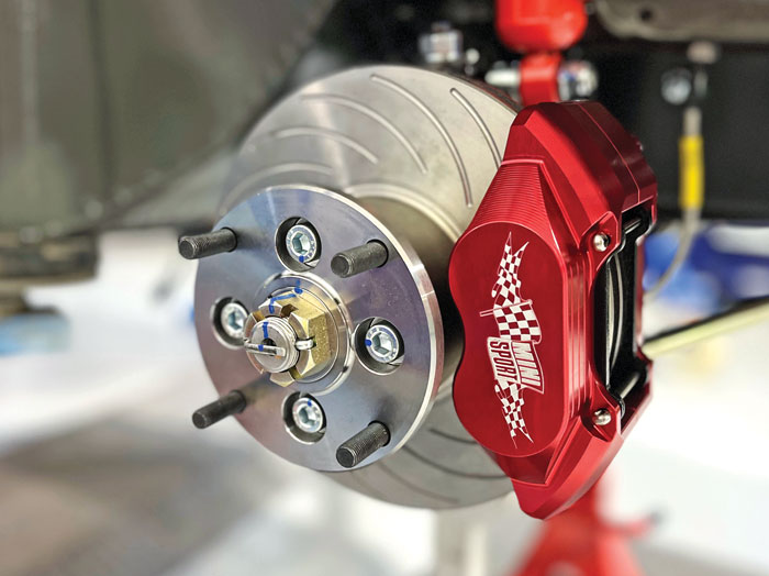 Mini Sport red-anodised 4-pot caliper fitted, accenting the Spectre’s custom wheels.