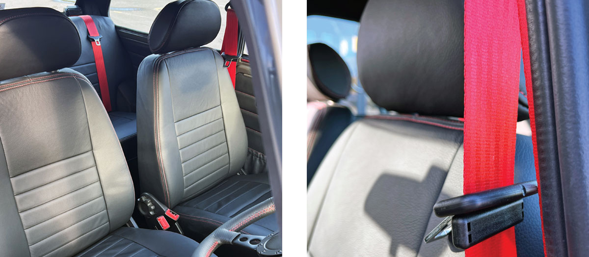 Custom-fitted black leather seats with red stitching, enhancing the interior of the Mini Spectre.